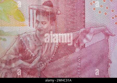 Makrofoto des Betawi-Masken-Tanzes auf der indonesischen 100-Tausend-Rupiah-Banknote. Der Betawi-Masken-Tanz ist eine traditionelle Kunst, und er ist Like Stockfoto