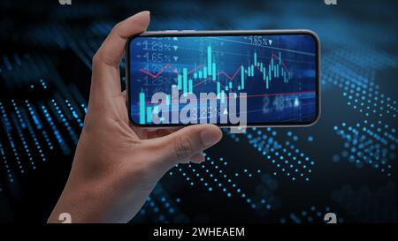 Mans Handheld Handy mit Aktiendiagrammen auf dem Bildschirm mit High-Tech Hintergrund Stockfoto