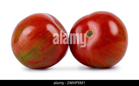 Rot mit grün gestreiften schwarzen Zebratomaten, isoliert auf weißem Hintergrund. Stockfoto