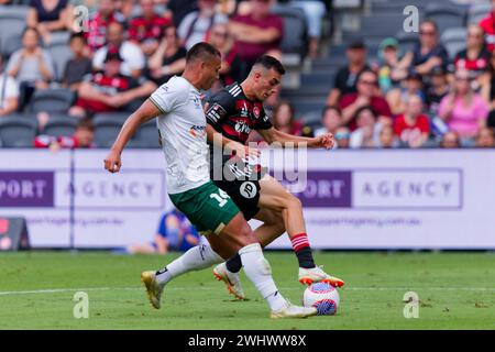 Sydney, Australien. Februar 2024. Dane Ingham aus Newcastle tritt am 12. Februar 2024 im CommBank Stadium in Sydney (Australien) mit Alexander Badolato von den Wanderers während des A-League-Spiels zwischen den Wanderers und Newcastle um den Ball an Stockfoto