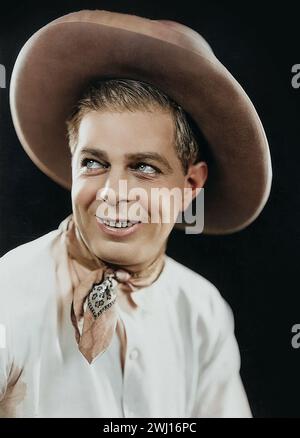 Westernstar Hoot Gibson von Jack Freulich (Universal, 1920er). Portraitfoto - Cowboy-Outfit - coloriert Stockfoto