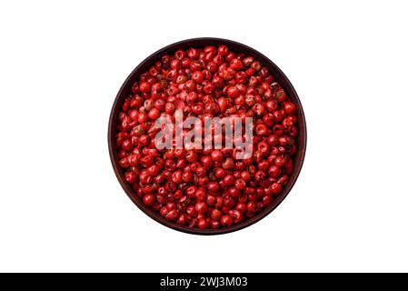 Gewürze, allspice Erbsen von roter oder rosa Farbe in einer Holzschale Stockfoto