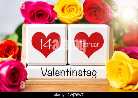 13. Februar 2024: Valentinstag, Begrüßung auf einem Kalender umgeben von bunten Rosen mit dem Datum 14. Februar in roten Herzen. FOTOMONTAGE *** Valentinstag, Gruß auf einem Kalender umgeben von bunten Rosen mit dem Datum 14 Februar in roten Herzen. FOTOMONTAGE Stockfoto