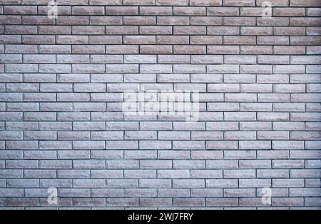 Backsteinwand Textur Hintergrund. Mauerwerk und Steinmetzfußboden innen steinaltes Muster, unebenes Ziegeldesign. Backsteinwand Hintergrund. Stockfoto