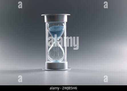 Nahaufnahme der Sanduhr mit blauem Sand auf grauem Hintergrund Stockfoto