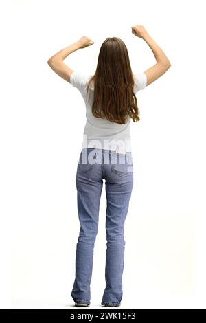 Eine Frau in voller Länge, auf weißem Hintergrund, hebt ihre Hände hoch Stockfoto