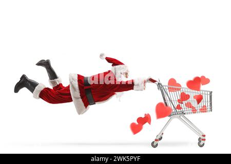 weihnachtsmann, der einen Einkaufswagen voller Herzen auf weißem Hintergrund hält Stockfoto