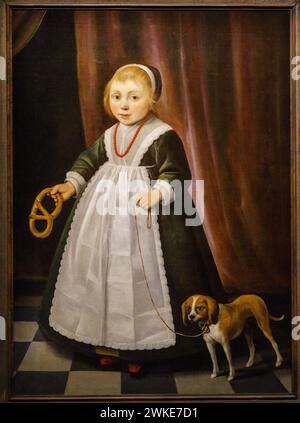 Ein Mädchen, das eine Brezel mit einem Hund an ihrer Seite hält, Jacob Gerrittz, Nins, Porträts von Kindern S. XVI-XIX, Sa Bassa Blanca Museum (msbb). Yannick Vu und Ben Jakober, Alcudia, Mallorca, Spanien. Stockfoto