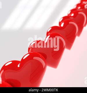 valentinsherzen aus Plastik in einer Reihe auf hellgrauem Hintergrund, Weichzeichner, 3D-Darstellung Stockfoto