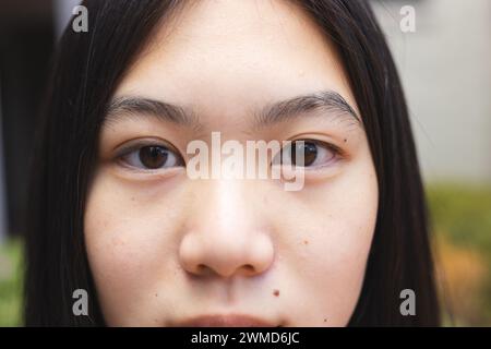 Nahaufnahme des Gesichtes eines Teenager-Asiaten Stockfoto