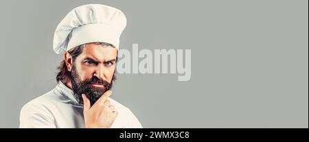 Bärtiger Koch, Köche oder Bäcker. Bärtige männliche Köche isoliert. Kochmütze. Selbstbewusster bärtiger Chefkoch in weißer Uniform. Ernsthaft kochen in weißer Uniform, Koch Stockfoto