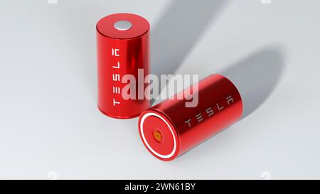 Zwei rote Lithium-Ionen-Batterie 4680 Tesla mit Logo, ein Hochleistungsakkumulator, Tischzelle, Energiespeicher, Produktion von Elektrofahrzeugen, High-Tech-Au Stockfoto