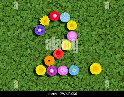 Nummer geschrieben mit bunten Blumen auf grünem Kleeblatt Hintergrund Stockfoto