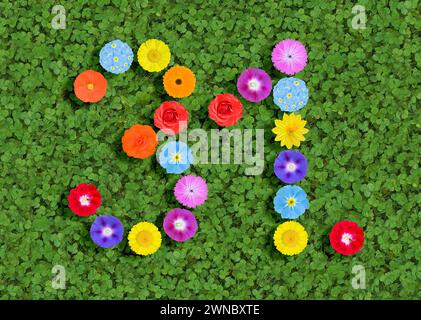 Nummer geschrieben mit bunten Blumen auf grünem Kleeblatt Hintergrund Stockfoto