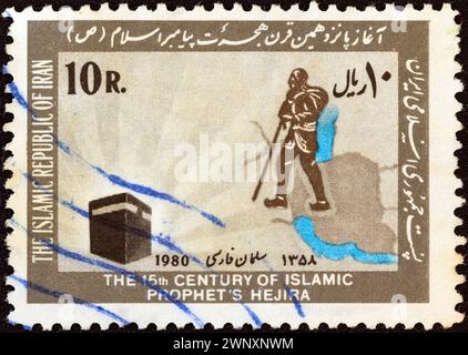 IRAN - UM 1980: Eine im Iran gedruckte Briefmarke aus der Ausgabe "Hegira (Pilgerjahr)" zeigt Salman Farsi (Anhänger Mohammeds), eine Karte von Iran und Kaaba Stockfoto