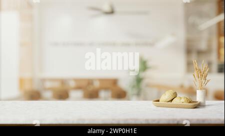 Ein weißer Marmortisch verfügt über einen Brotkorb, getrocknetes Pampasgras in einer Keramikvase und einen Kopierraum mit einem unscharfen Hintergrund eines minimalen Kuscheldorfes Stockfoto