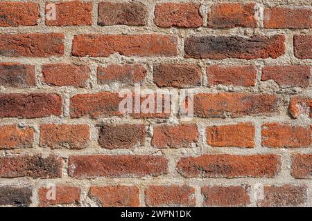 Hintergrund einer alten roten Backsteinmauer Stockfoto