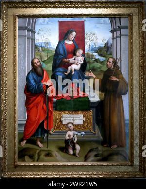 Italien Emilia Romagna Bologna - nationale Kunstgalerie - Madonna und Kind thront und die Heiligen Paul, Franziskus und Johannes der Täufer. (Pala Scappi) von Raibolini Francesco genannt il Francia - 1495 Stockfoto