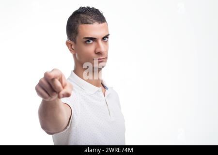 Mit einem fokussierten Ausdruck weist er nach vorne und vermittelt ein Gefühl für einen Zweck Stockfoto
