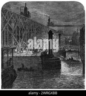 Abriss der Blackfriars Bridge, [London], 1864. Blick vom Surrey-Ufer der Themse aus, zeigt... das Gerüst, das die Entfernung von Materialien erleichtert...[auch sichtbar sind] die provisorische Holzbrücke...[und] die eiserne Brücke der London, Chatham und Dover Railway... die alte Brücke, von der die Überreste so schnell verschwinden, wurde vor etwa hundert Jahren gebaut, wurde 1760 begonnen und 1769 fertiggestellt... in dieser Jahreszeit, wenn die Tage so kurz sind, müssen die Männer abends im Licht von Naphtha-Lampen arbeiten... Ein neuartiges Merkmal im mechanischen A Stockfoto