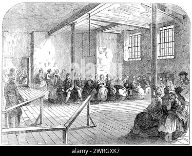 The Cotton Famine: Warteraum in der District Provident Institution, Manchester, 1862. Blick auf die Vorkammer der Küche... hier beginnt die Verteilung der Suppe an arbeitslose Lancashire Textiles Workers um acht Uhr, und eine Reihe von Freunden beaufsichtigt die Operation persönlich. Ein großer Teil der Fahrkarten, für die es gegeben wird, wird von den verschiedenen Hilfsorganisationen der Stadt gekauft, um sie als Teil ihrer Entlastung zusätzlich zu Brot und Fleisch kostenlos zu verteilen. Die Vorkehrungen sind sehr vollständig. Gegenwärtig können 1000 Liter Suppe am Tag zubereitet werden, und Stockfoto