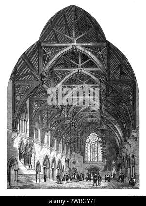 Die Eingangshalle der neuen Assize Courts in Manchester, 1864. Blick auf den Innenraum. Der Architekt Mr. A. Waterhouse von New-Street, Spring-Gardens... hat das, was zu jedem Vergleich, das beste Gebäude geschaffen wurde, das jemals in England für einen ähnlichen Zweck errichtet wurde... das Innere ist symmetrisch und bequem angelegt... verbunden mit den Höfen ist eine prächtige Halle, mit tesselliertem Pflaster zur Promenade - die Salle des pas perdus... Der Stil der Architektur ist eine florierende venezianische Gotik...es ist mit einem Hammerbalkendach aus offenem Holz bedeckt, die Zwischenräume zwischen den Sparren sind schmerzhaft Stockfoto