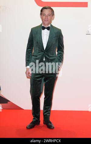 Rom, Italien. März 2024. VolkerBruch besucht den roten Teppich der Premiere des Films „Race for Glory“ im Space Cinema Moderno. Quelle: SOPA Images Limited/Alamy Live News Stockfoto