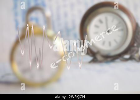 E-Commerce-Konzept mit Schreiben auf einem Glas und 2 Uhren im Hintergrund Stockfoto