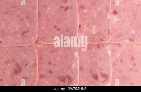 Scheiben Schweineschinken als Hintergrund, Nahaufnahme, Draufsicht Stockfoto