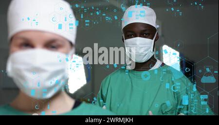 Bild des dna-Strangs über verschiedenen Chirurgen im Krankenhaus Stockfoto