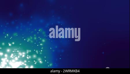 Eine lebendige Anzeige von blauen und grünen Lichtpartikeln schafft eine magische Atmosphäre Stockfoto