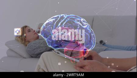 Bild des digitalen Gehirns über der kaukasischen Beratungspsychologin Stockfoto