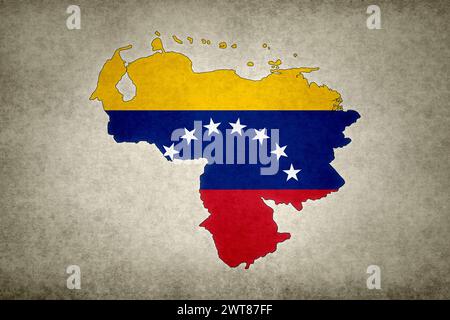 Grunge-Karte von Venezuela mit der Flagge innerhalb der Grenze auf einem alten Papier gedruckt. Stockfoto