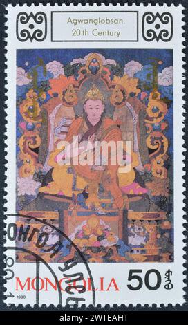 Von der Mongolei gedruckte Briefmarke, die Agwanglobsan zeigt, um 1990. Stockfoto