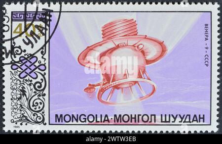 Von der Mongolei gedruckte gestempelte Briefmarke, die Venera 9 zeigt, um 1985. Stockfoto