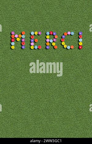 Merci danke danke Sie in Sprache geschrieben mit Blumen französischer Stockfoto