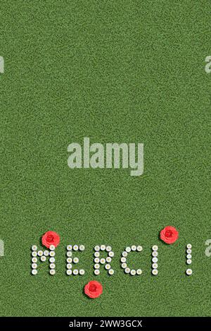 Merci danke danke Sie in Sprache geschrieben mit Blumen französischer Stockfoto