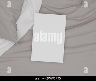 Dieses Bild zeigt ein Cover-Buch-Modell in einem Bett. Das Bild ist sehr realistisch. Es ist sehr einfach zu bedienen. Stockfoto