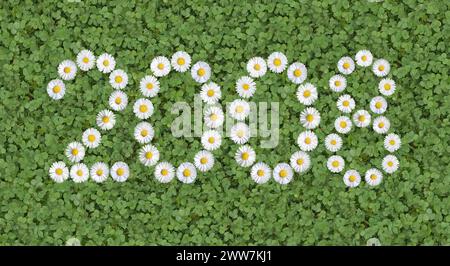 Das Jahr 2008 schrieb mit Gänseblümchen auf einer Kleewiese als digitale Komposition Stockfoto