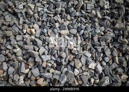 Natürliche Farben von Steinfragmenten aus vulkanischen Felsen als Hintergrund. Stockfoto