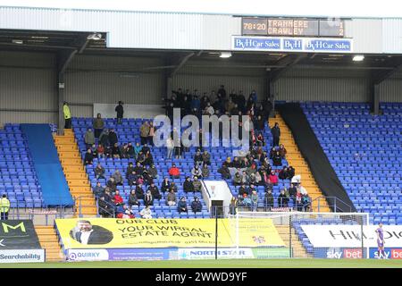 Birkenhead, Großbritannien. März 2024. Crawley Town Fans im Kuhschuppen Stand. EFL Skybet Football League Two Match, Tranmere Rovers gegen Crawley Town im Prenton Park, Birkenhead, Wirral am Samstag, 23. März 2024. Dieses Bild darf nur für redaktionelle Zwecke verwendet werden. Nur redaktionelle Verwendung, .PIC von Chris Stading/ Credit: Andrew Orchard Sportfotografie/Alamy Live News Stockfoto