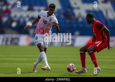 Frisco, Texas, USA. März 2024. ANDRE RAYMOND (18) aus Trinidad und Tobago (8) verteidigt den Ball, als ISMAEL KONE (8) am Samstag im Toyota Stadium in Frisco, Texas, bei ihrem Spiel der CONCACAF Nations League verteidigt. (Kreditbild: © Brian McLean/ZUMA Press Wire) NUR REDAKTIONELLE VERWENDUNG! Nicht für kommerzielle ZWECKE! Quelle: ZUMA Press, Inc./Alamy Live News Stockfoto