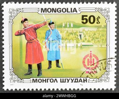 Von der Mongolei gedruckte Briefmarke, die Archers zeigt, um 1981. Stockfoto