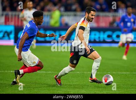 Ilkay Gündogan, DFB 21 tritt um den Ball, Tackling, Duell, Header, zweikampf, Aktion, Kampf gegen Aurelien Tchouameni, FRA 8 im Freundschaftsspiel FRANKREICH - DEUTSCHLAND 0-2 FRANKREICH - DEUTSCHLAND 0-2 in Vorbereitung auf die Europameisterschaft 2024 am 23. März 2024 in Lyon, Frankreich. © Peter Schatz / Alamy Live News Stockfoto