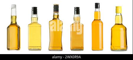 Viele Flaschen Whiskey isoliert auf weiß, Set Stockfoto