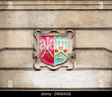 Wappen an einer Außenwand des Oriel College, University of Oxford, England. Stockfoto