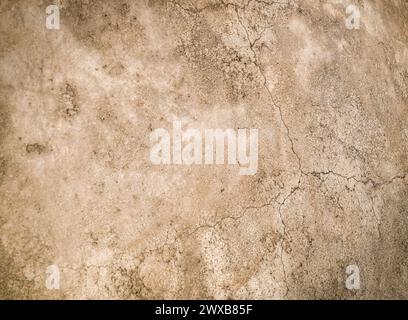 Alte verputzte Wand mit Rissen als Hintergrund Stockfoto