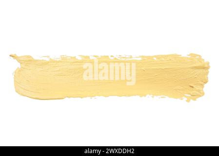 Farbkorrekturkontur isoliert auf weißem Hintergrund. Pfirsichfarbe korrigierende Creme Concealer widge Smudge Swatch Swatch Probe. Make-up Basis Foundation cremig Stockfoto