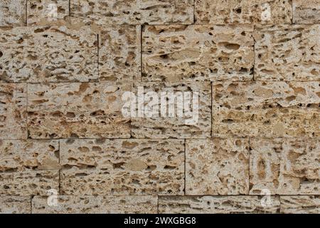 Muster Ziegelblöcke Schale Sand Stein Wand Textur Hintergrund abstrakt. Stockfoto