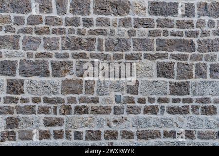 Textur einer alten Mauer aus Stein Stockfoto